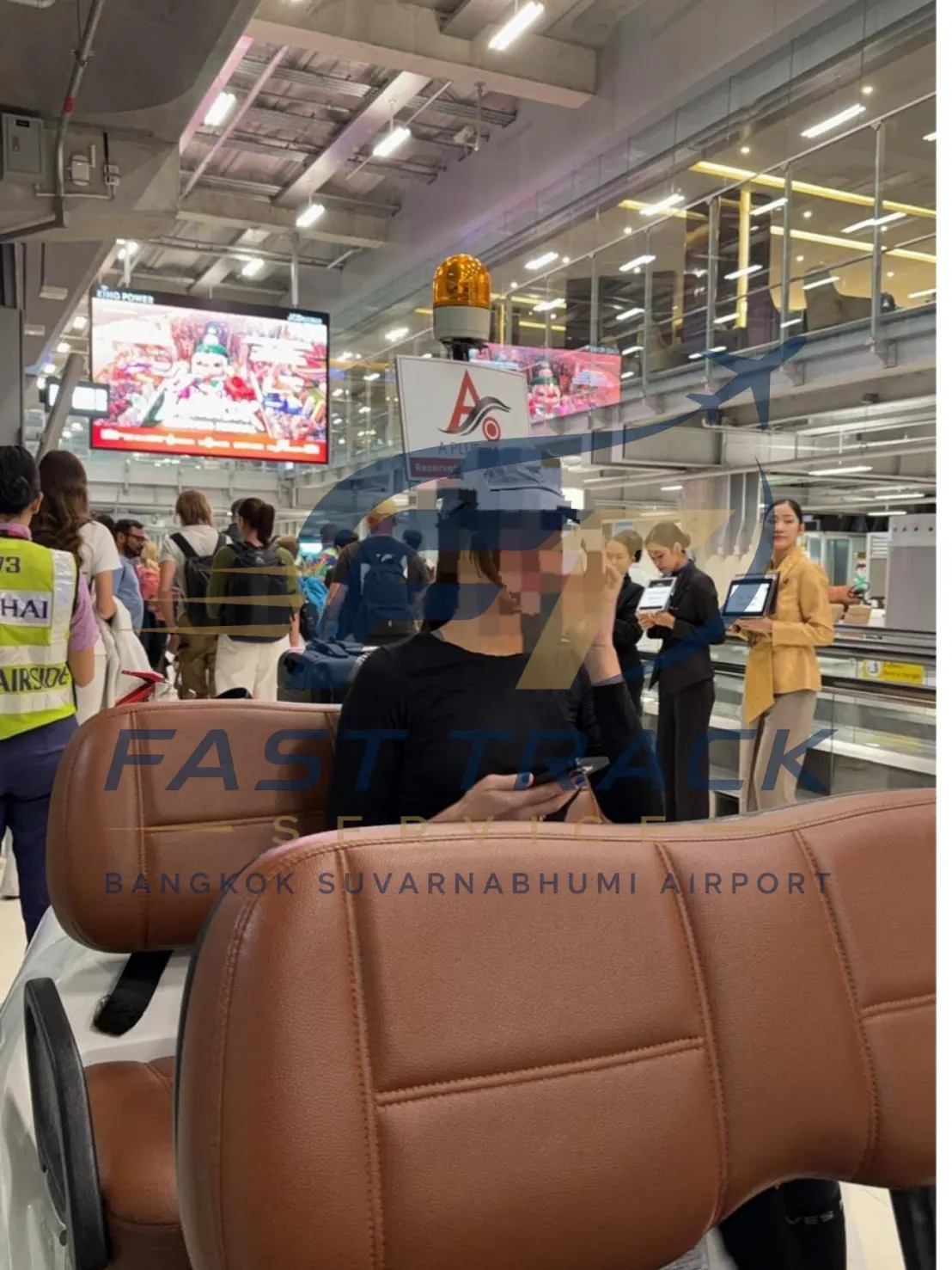 Traveller riding a buggy through the Suvarnabhumi terminal