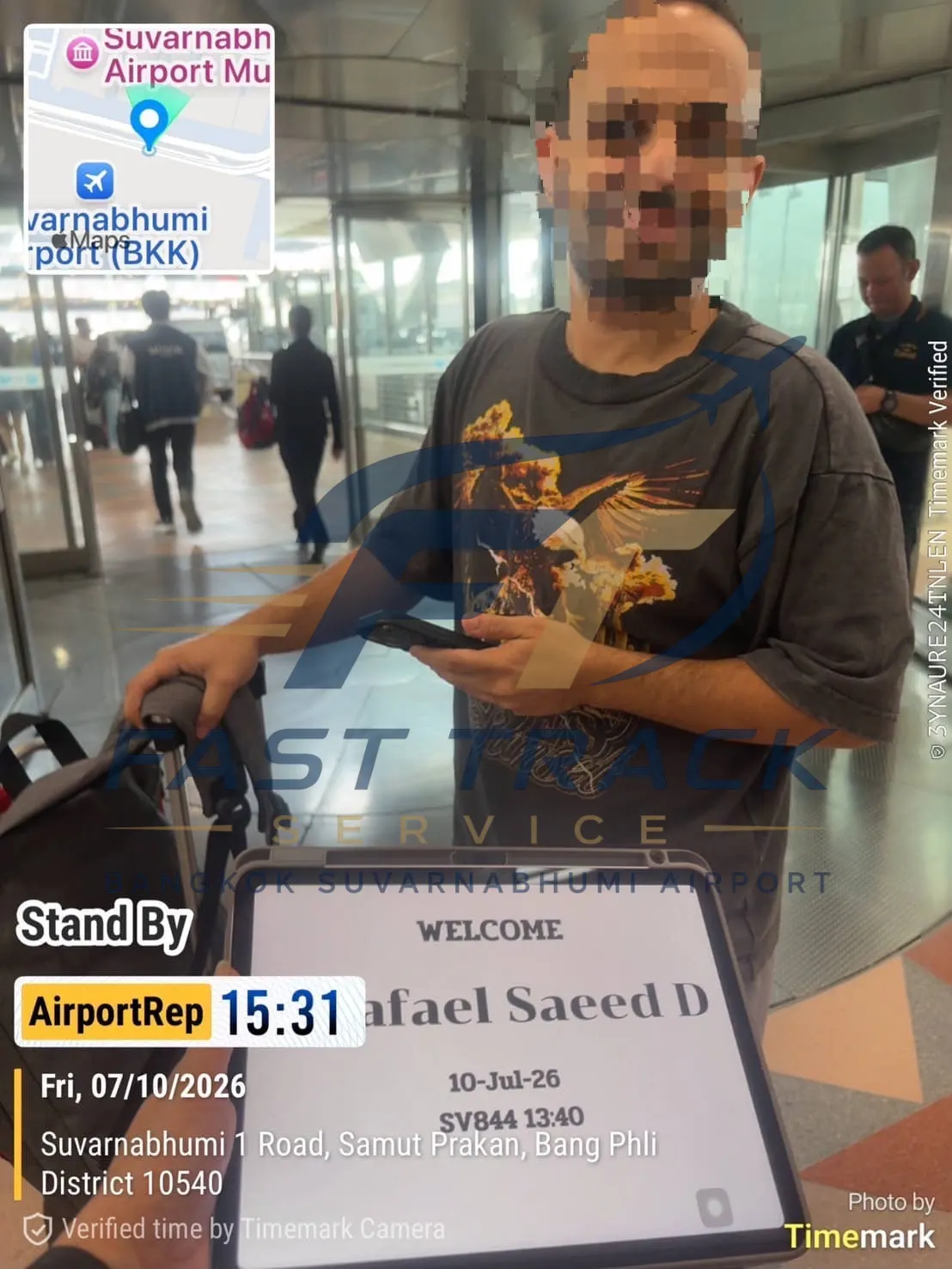 Greeter holding a FastTrack welcome tablet